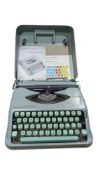 20TH CENTURY VINTAGE HERMES BABY TYPEWRITER W/ CARRY CASE AND INSTRUCTION BOOKLET