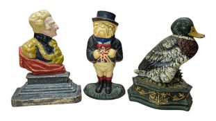 THREE 20TH CENTURY NOVELTY CAST IRON DOOR STOPS