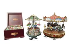 THREE CONTEMPORARY CHRISTMAS DECORATIVE CAROUSELS