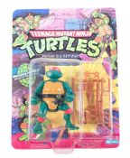 TEENAGE MUTANT NINJA TURTLES - PLAYMATES MICHAELANGELO CARDED FIGURE