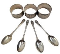 THREE HALLMARKED SILVER NAPKIN RINGS & THREE SILVER TEASPOONS