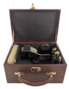 SMALL 20TH CENTURY CASED LEATHER TRAVELLING VANITY SET