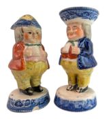A PAIR OF 19TH CENTURY STAFFORDSHIRE TOBY SALT AND PEPPER DISPENSERS