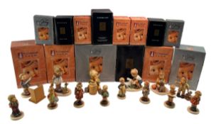 FOURTEEN GOEBEL M J HUMMEL PORCELAIN FIGURINES IN ORIGINAL BOXES