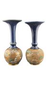 ROYAL DOULTON - A PAIR OF LATE 19TH CENTURY LAMBETH STONEWARE BUD VASES