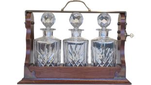 TANTALUS - VINTAGE 20TH CENTURY MAHOGANY TANTALUS WITH CUT GLASS DECANTERS