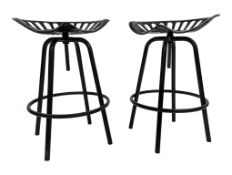 PAIR OF VINTAGE BLACK CAST METAL TRACTOR BAR / KITCHEN STOOLS