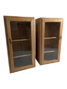 ERCOL FURNITURE - PAIR OF BEECH & ELM LATE 20TH CENTURY MUSIC CABINETS