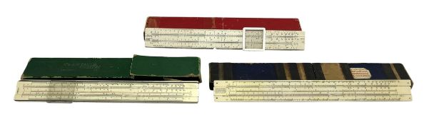 THREE 20TH CENTURY VINTAGE SLIDE RULERS IN CASES