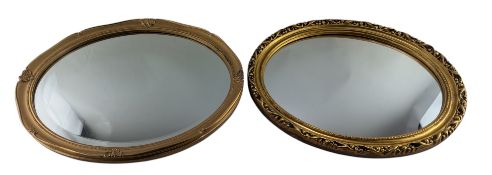 TWO REPRODUCTION GILT OVAL WALL HANGING MIRRORS