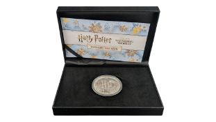 THE HARRY POTTER STERLING SILVER CHRISTMAS MEDAL
