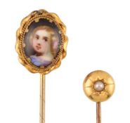 TWO ANTIQUE YELLOW METAL STICK PINS