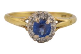 18CT GOLD SAPPHIRE & DIAMOND HALO RING