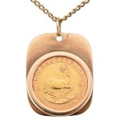 A 9CT GOLD MOUNTED 1/10TH KRUGERRAND
