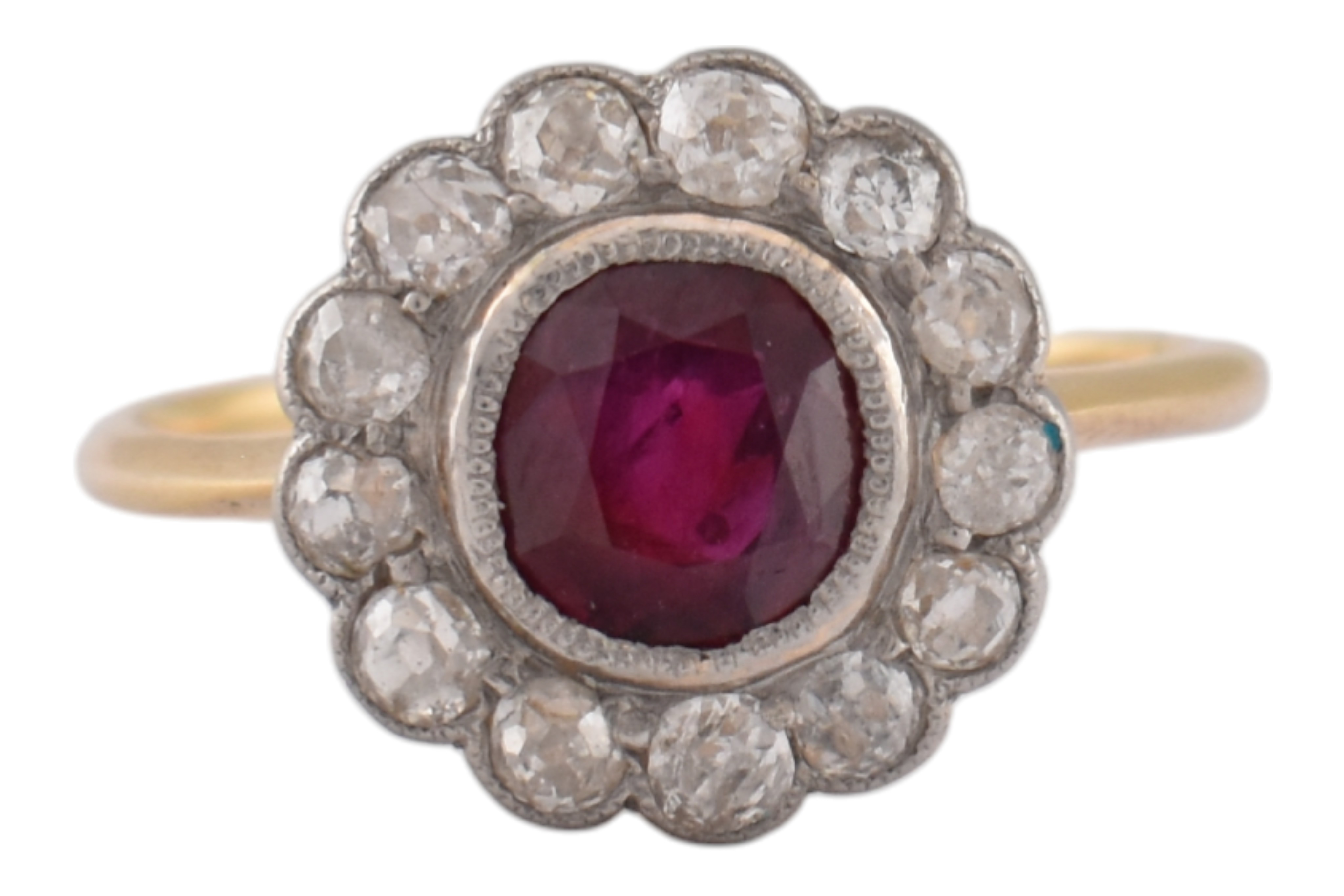 Ruby Early Rolph Early 20th century ruby and diamond halo ring. The ring with a central ...