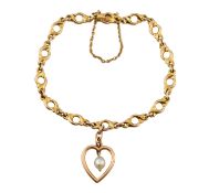 EARLY 20TH CENTURY 15CT GOLD FANCY LINK BRACELET WITH HEART CHARM