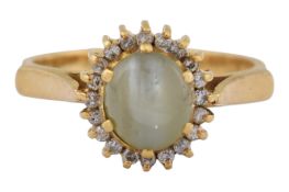 18CT GOLD CAT'S EYE CHRYSOBERYL & DIAMOND HALO RING
