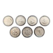 SEVEN UNITED STATES HALF DOLLAR COINS