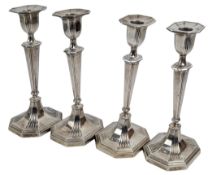 FOUR EDWARD VII HALLMARKED SILVER CANDLESTICKS