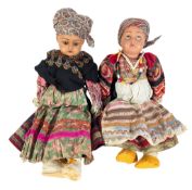 TWO EARLY 20TH CENTURY BISQUE HEADED DOLLS IN HUNGARIAN ATTIRE