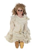 DOLLS - AN ANTIQUE BISQUE HEADED DOLL WITH PULL STRING VOICE BOX