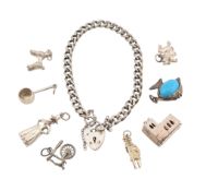 1970S SILVER CHARM BRACELET & WHITE METAL CHARMS