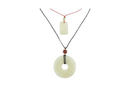 TWO CHINESE JADE PENDANT NECKLACES