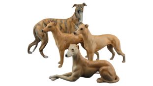 COLLECTION OF FOUR 20TH CENTURY PORCELAIN GREYHOUND DOG FIGURES