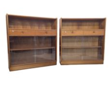 A PAIR OF MID-CENTURY NATHAN TEAK BOOKCASES WITH DRAWERS TO CENTRE