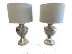 PAIR OF CONTEMPORARY SILVER POLISHED WHITE METAL LAMPS