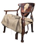 EARLY 20TH CENTURY OAK AND LEATHER FIRESIDE ARMCHAIR