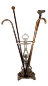 LATE 20TH / 21ST CENTURY CAST IRON STICK STAND W/ FOUR WALKING CANES