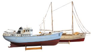 TWO MODEL SAILING BOATS COMPLETE WITH STANDS