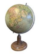 EARLY 20TH CENTURY VINTAGE GLOBE RAISED ON A TURNED WOODEN BASE