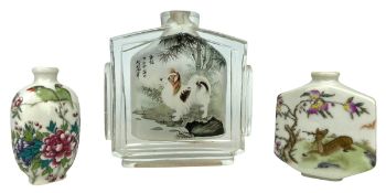 THREE SNUFF BOTTLES ONE PAINTED WITH DOGS AND TWO PORCELAIN SNUFF BOTTLES