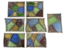 SEVEN SMALL 20TH CENTURY LEADED STAINED GLASS PANELS
