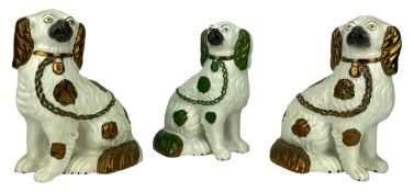 COLLECTION OF THREE 19TH CENTURY STAFFORDSHIRE FIRESIDE DOGS