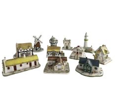 A COLLECTION OF ELEVEN COALPORT FINE BONE CHINA COTTAGE FIGURINES