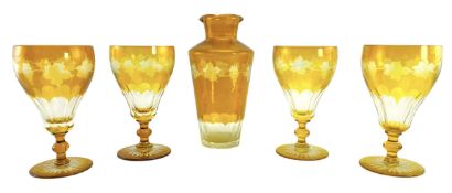 FOUR EARLY 20TH CENTURY AMBER GLASS GOBLETS & DECANTER