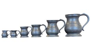 COLLECTION OF 19TH CENTURY GRADUATING METAL PEWTER TANKARDS