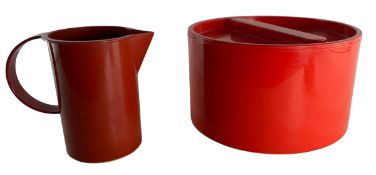A LATE 20TH CENTURY PAIR RED STORAGE CONTAINER AND JUG