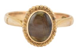 14CT GOLD & BLACK STAR SAPPHIRE CABOCHON RING