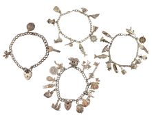 A COLLECTION OF FOUR VINTAGE CHARM BRACELETS
