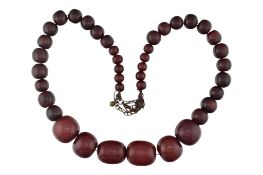 A CHERRY AMBER BAKLITE BEAD NECKLACE
