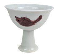 CHINESE COPPER-RED ‘THREE FISH’ PORCELAIN STEM CUP 釉里鱼纹红高足杯