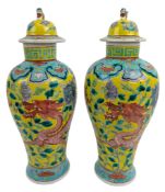 PAIR OF 19TH CENTURY CHINESE LIDDED URNS 清 黄地龙穿牡丹盖罐一对
