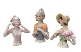 THREE GERMAN EARLY 20TH CENTURY HAND PAINTED PORCELAIN HALF DOLLS