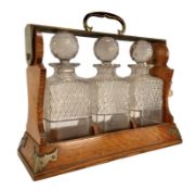 EARLY 20TH CENTURY BETJEMANNS PATENTED OAK & METAL TANTALUS