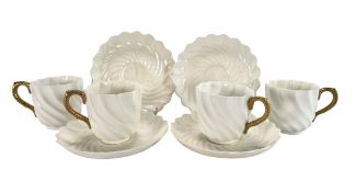 FOUR COALPORT LATE 19TH CENTURY PARCEL GILT PORCELAIN COFFEE CUPS & SAUCERS