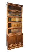GLOBE WERNICKE - 20TH CENTURY OAK FIVE TIER & CUPBOARD BASE STACKING BOOKCASE